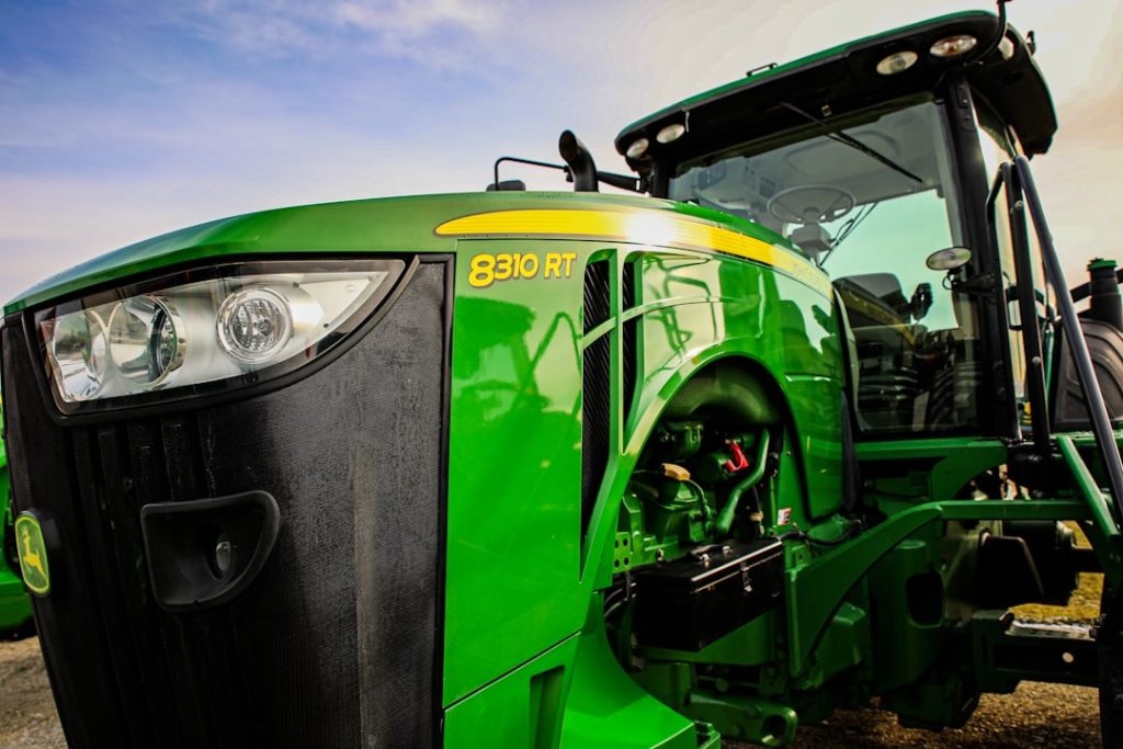 a-close-up-of-the-front-of-a-green-tractor-m-lhuhxczxi